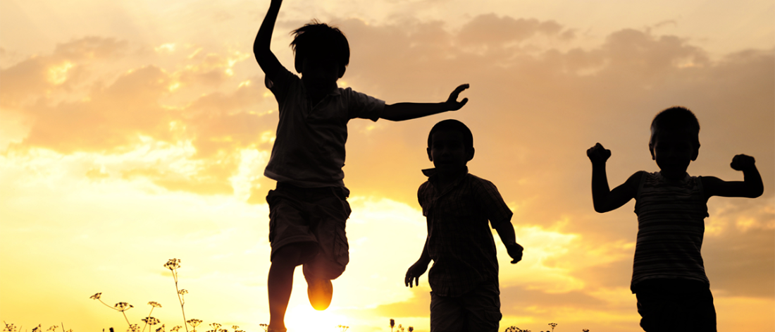 Children playing at sunset/dawn