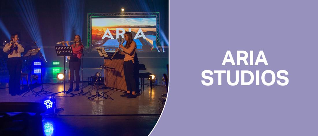 3 students playing instruments at Aria Studios 