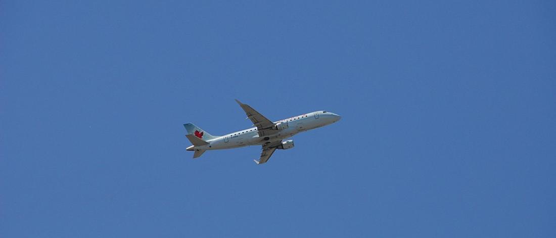 An airplane against a blue sky