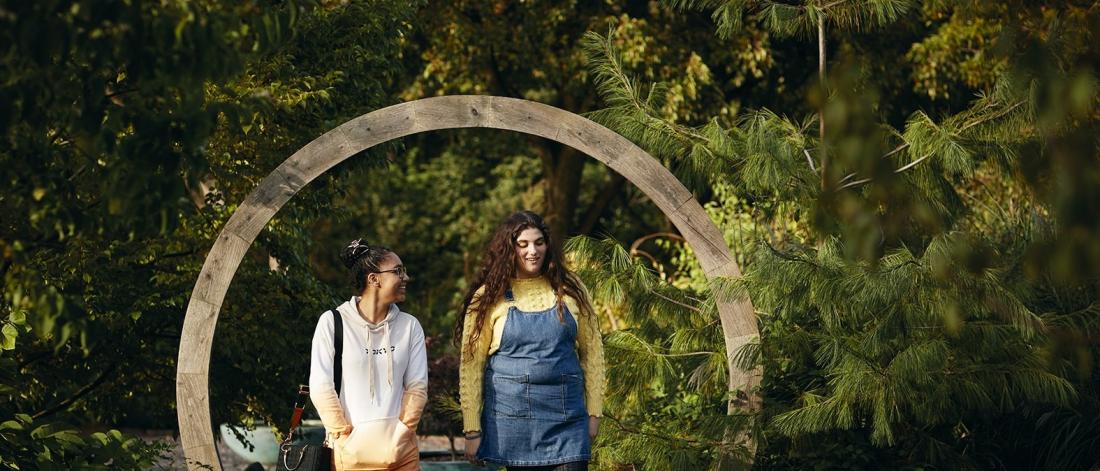 Image of people walking through Treborth Gardens