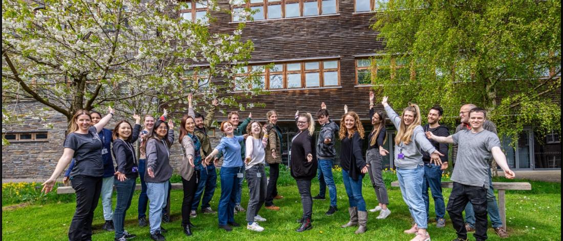  a group of people with arms outstretched