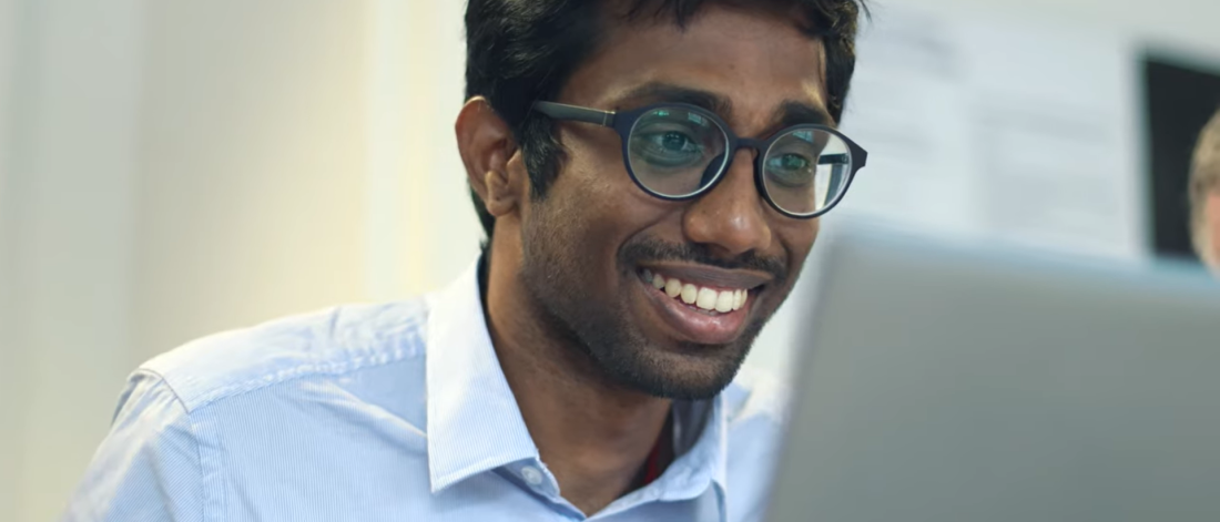 Image of Sakthi Sundharam in front of a laptop