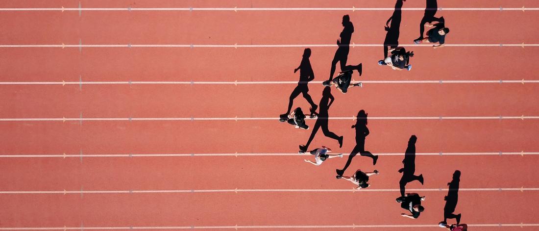 shade of runners on running track