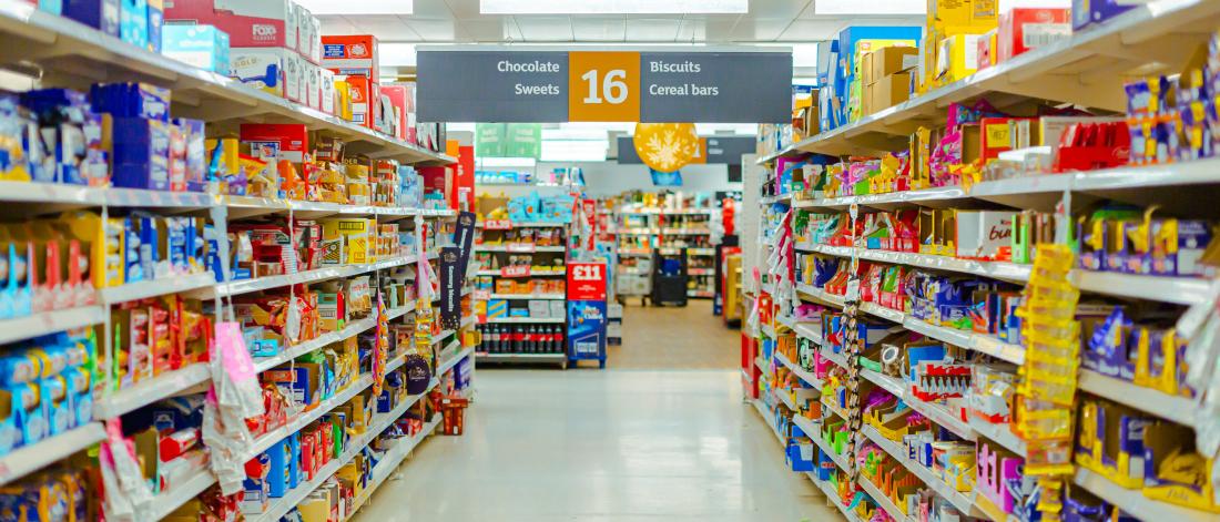 A supermarket aisle full of tinned products 