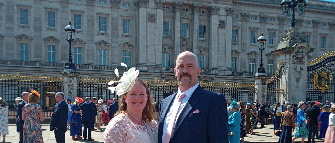 Graham French with his wife Julie in front of Buckingham Palace