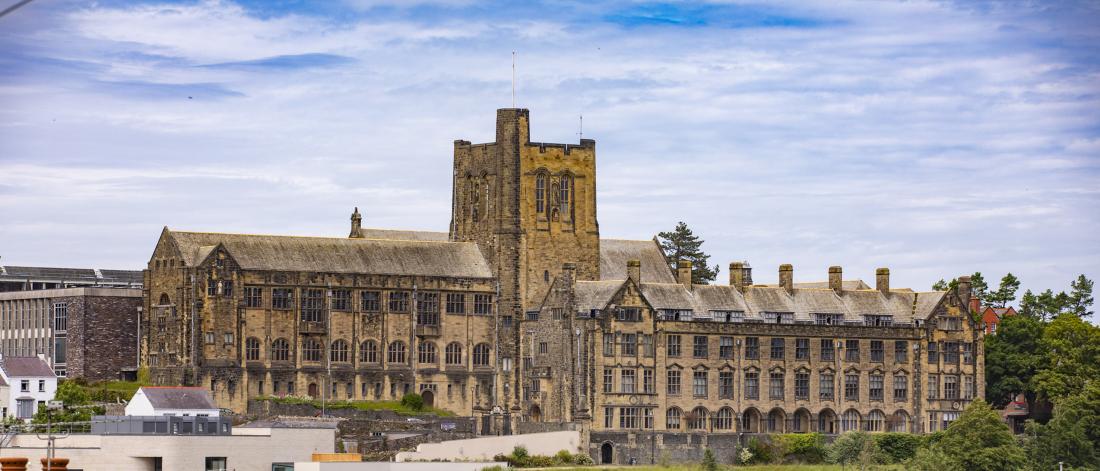Main University Building with rooftops in foreground