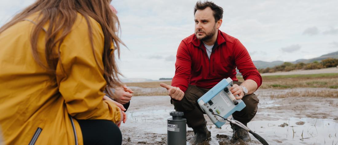 two researcher on a beach