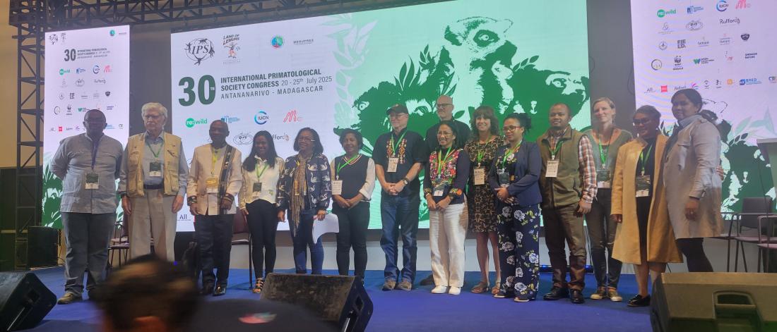 Photo of symposium attendees on stage