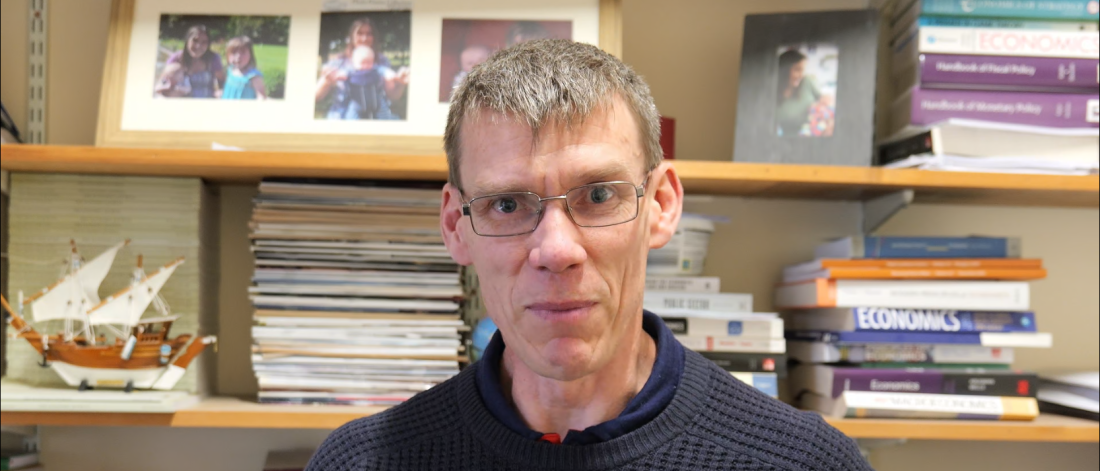 a headshot of Rhys Ap Gwilym