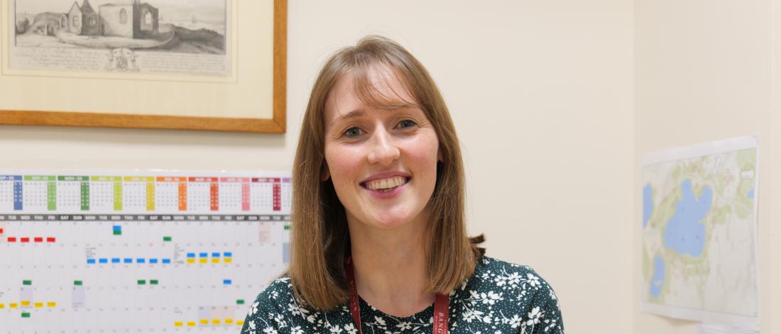 A picture of Leona smiling to camera