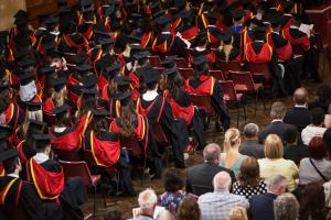 Students in PJ Hall during graduation ceremony