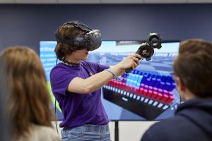 Students working with a Virtual Reality headset