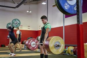 Students using the weightlifting facilities at the University's Canolfan Brailsford