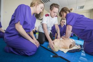 Student nurses learning how to give CPR