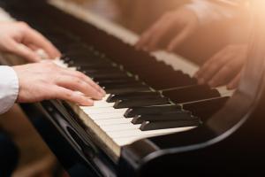 Close-up of a piano being played