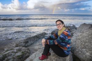 Person with sea in the background