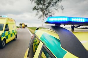 ambulance on the road with flashing blue light