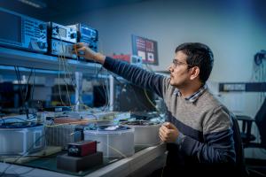 Researcher working on equipment at DSP Centre