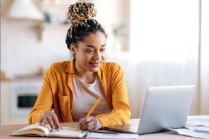 Person sitting in front of laptop