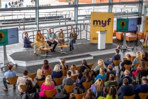 people taking part in a panel discussion at the Senedd launch