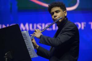 young man playing the flute