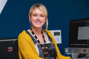 Woman wearing talk welsh lanyard