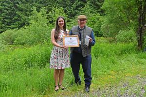 Landscape image of Karen winning an award