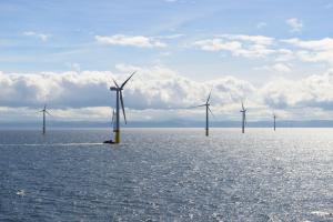 An array of wind turbines stand in Gwynt y Môr offshore wind farm