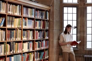 Student reading in the Bangor University Library 