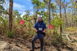 Alumni Richard Hughes working in a wooded area