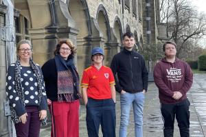 Picture showing Rhian Hodges, Mari Wiliam and students on the Teras outside the Main University Building