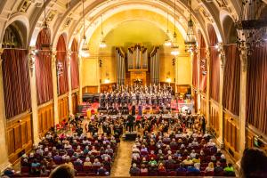 Concert hall with orchestra and audience