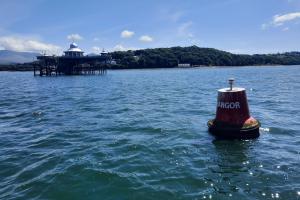 Image of Bangor pier taken from a boat on the Menai Strait 