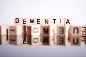 DEMENTIA written with Scrabble tiles