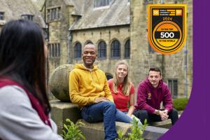 People in inner quad with  QS ranking badge top right 