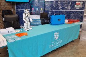 Welcome table and robot for IET open house event