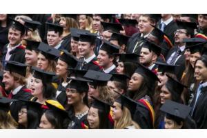 Students in their caps and gowns in the Graduation ceremony.