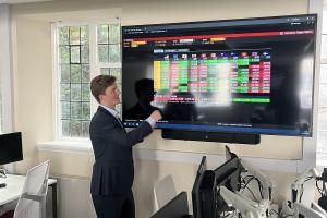 Mr Isaac Tonkin visiting guest speaker from Australis visiting the trading floor in Bangor University