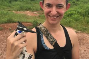 Dr Kristen Crandell holding a bird