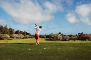 Man in White T Shirt Playing Golf