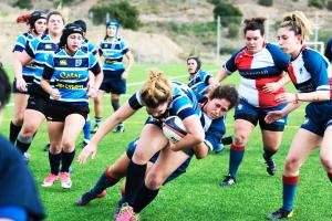 Female Rugby Players on the field.