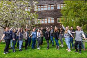  a group of people with arms outstretched