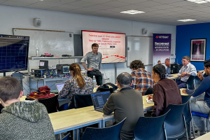 Group of students and individuals from industry receiving a training seminar