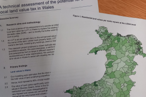 A image of the report on the table with a map of Wales.