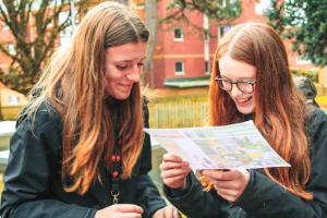 Two young people looking at a map