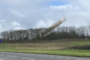  chimney fallingmid-demolition