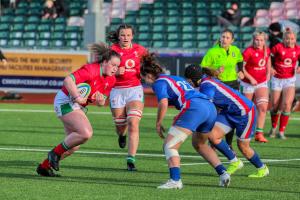 Female rugby players in action on the pitch