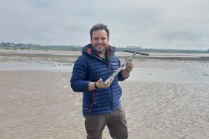 Professor Christian Dunn on a beach in Normandy