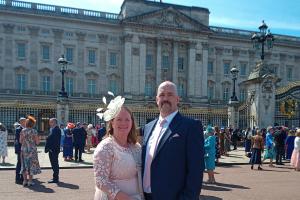 Graham French with his wife Julie in front of Buckingham Palace