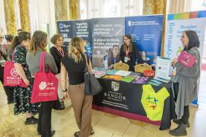 People in front of exhibition at conference